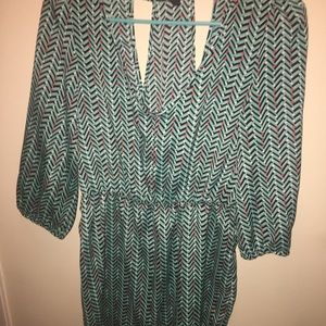 Short green multi-colored long sleeved dress.